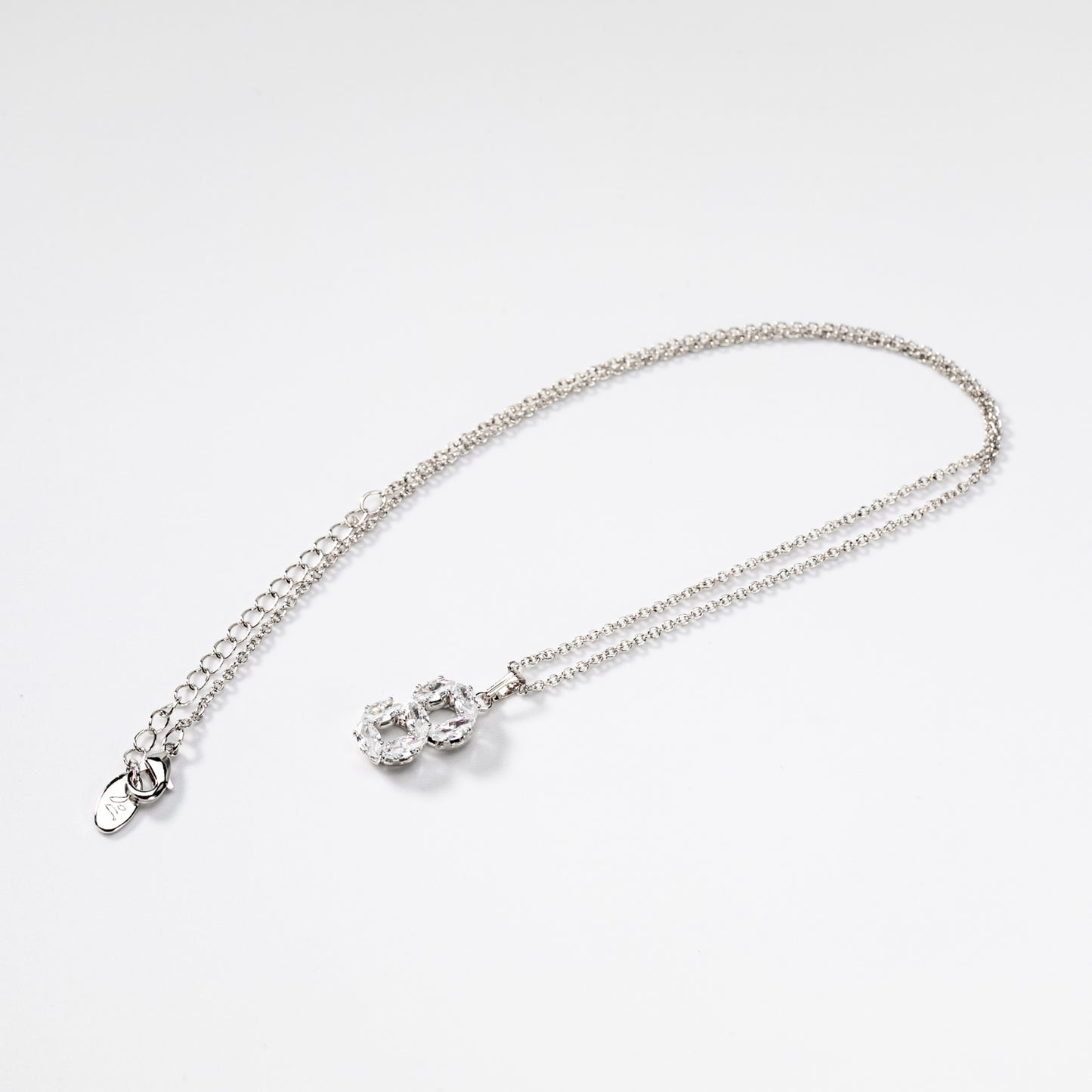 Rhodium-plated metal Circles of bright ovals jewel set